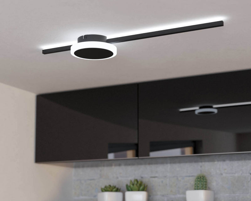 Minimalist black LED semi-flush mount with circular ring and linear bar over gloss kitchen cabinetry